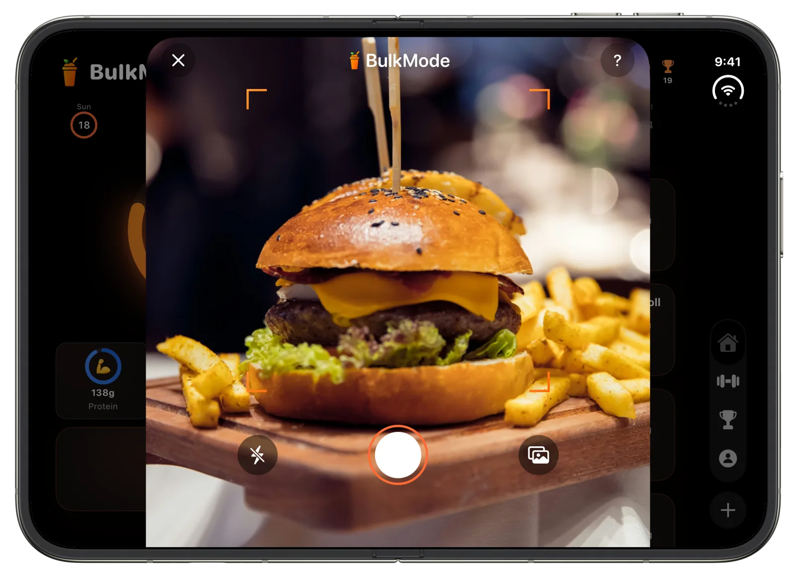 The BulkMode camera on an open iPhone Duo, framing a burger and fries